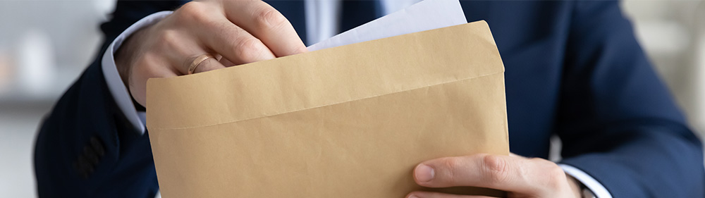 putting forms into envelope