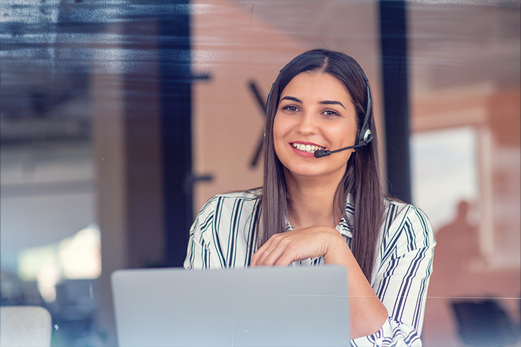 Customer Service Rep on Phone Smiling