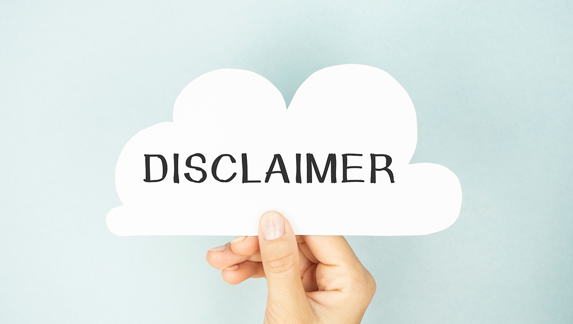 Hand holding Disclaimer Sign